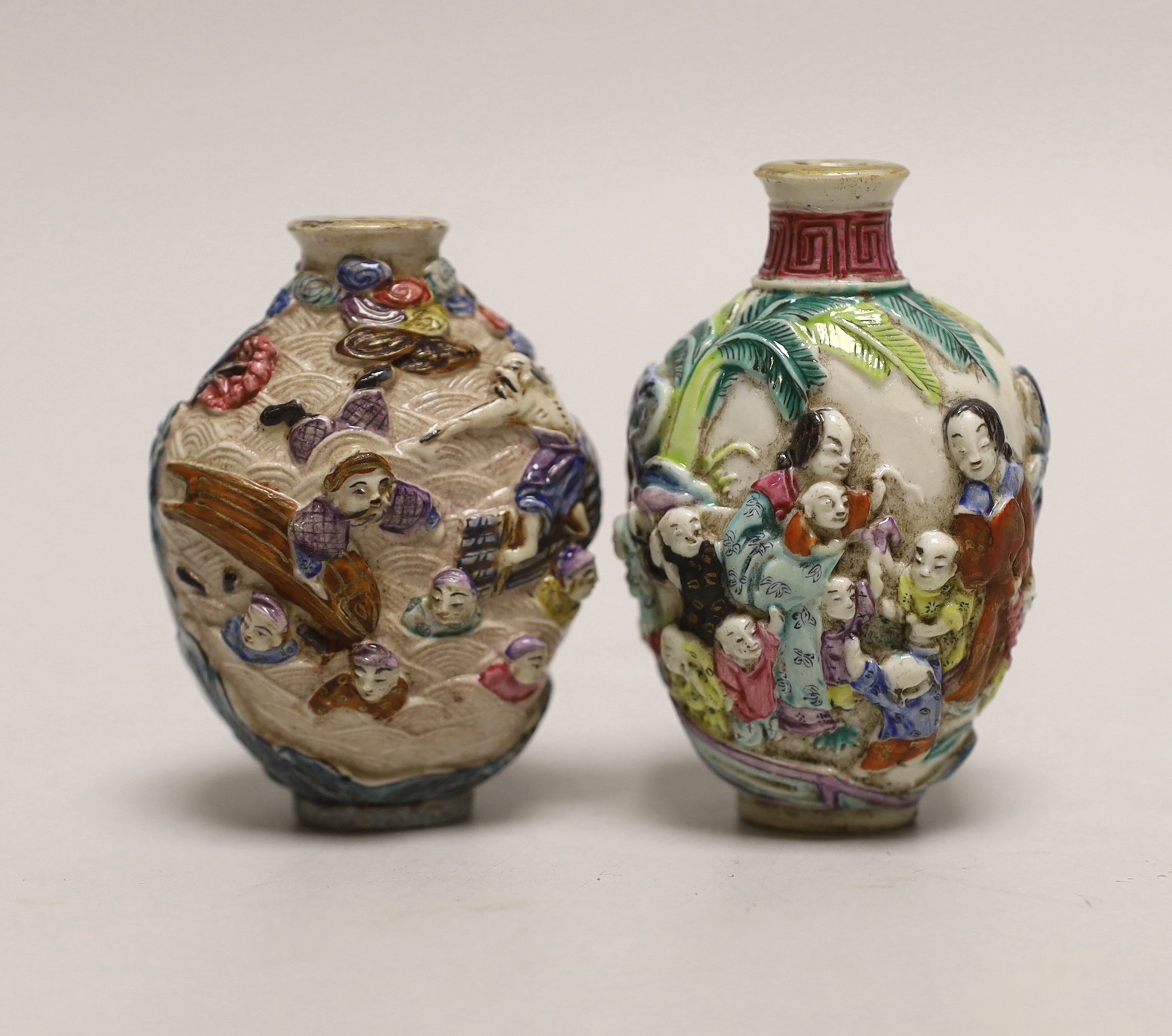 Two Chinese enamelled and moulded porcelain snuff bottles, Qianlong marks but mid 19th century